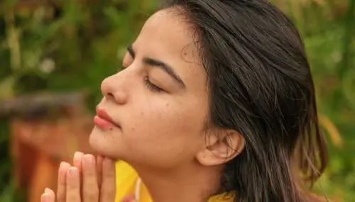 Girl deep breathing with her eyes closed